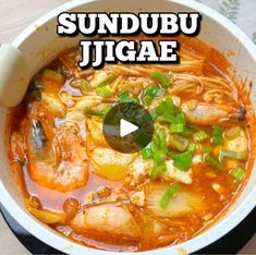 the video shows how to make sundubu jigae with shrimp and vegetables