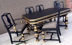 a black and gold dining table with six chairs next to a garage door on the sidewalk