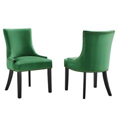 a pair of green chairs with studded trimmings on the back and sides