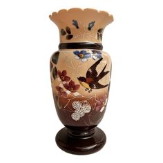 a decorative vase with birds and flowers painted on it