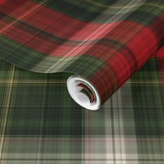 a red and green plaid wallpaper with a white circle at the center on it