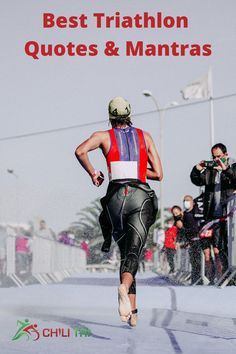 a man running in the rain with his back to the camera and people watching him