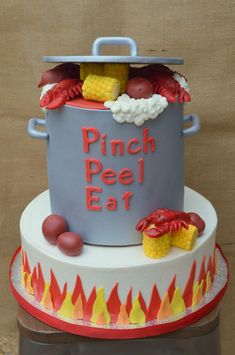 a cake that has been decorated to look like a pot with food in it and the words pinch pee eat