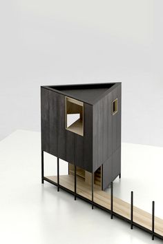 a small wooden structure with an open door