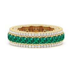 This dazzling ring showcases a magnificent combination of vintage femininity and royal opulence. The entire circumference of the ring is meticulously covered with diamonds. Laid at the center are prong-set created Emerald princess, bordered on two sides with petite round diamonds on micro prongs. The inner edge of the ring is decorated with a scalloped detail traced by tiny milgrain beads and punctuated by more round diamonds. Luxury Brilliant Cut Emerald Ring With Round Band, Luxury Brilliant Cut Emerald Ring, Elegant Green Diamond Eternity Band, Luxury Emerald Ring With Prong Setting, Luxury Eternity Band With Pave Setting For Anniversary, Luxury Emerald Ring With Round Diamond Band, Luxury Emerald Half Eternity Diamond Ring, Emerald Eternity Band With Prong Setting For Formal Occasions, Formal Emerald Eternity Band With Prong Setting