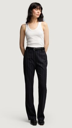 Unleash your inner sartorialist with our impeccably tailored Straight Leg Trouser. The navy pinstripe pattern provides your look with a subtle-yet-sophisticated flair. Whether you’re commuting to work or heading to cocktail hour, these versatile trousers are your key to effortless elegance. Womens Wool Pants, Commuting To Work, Pinstripe Pattern, Denim Outerwear, Wear Green, Effortless Elegance, Straight Leg Trousers, Short Jumpsuit, The Navy