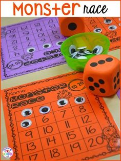 some dices and numbers on a table with the words monster race in front of them