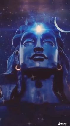 an image of the face of buddha with stars in the sky