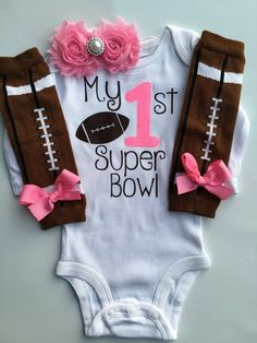 "This is a perfect outfit for your tiny little football fan! :) CHOOSE from one or all 3 pieces from the drop-down bar. If you choose \"FULL 3 piece set\", you will receive: bodysuit, headband and legwarmers *Please see 2nd photo for legwarmers specifics** PIECES INCLUDE: (you will choose your pieces from drop-down bar) 1.LONG OR SHORT SLEEVED \"My 1st Super Bowl\" bodysuit. 2. Also included are small football legwarmers (see phone #2 for details) adorned with a bow on each. 3. A coordinating sh Girls Football Outfit, Baby Football Outfit, Newborn Football, Tattoo For Baby Girl, Gold Bodysuit, Football Outfit, Sublimacion Ideas, Baby Leg Warmers, Baby Legs