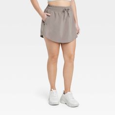 Why we're ALL IN: Woven mid-rise skort with built-in shorts in a regular-fit silhouette makes a cool choice for your active days. Moisture-wicking, quick-dry lightweight fabric helps you stay cool, while a drawcord elastic waistband provides a snug fit. Side pocket provides hands-free convenience and the UPF 50+ rating offers sun protection. All in Motion™: Made for every move, priced for every day. Casual Activewear With Built-in Shorts Above Knee, Sporty Mid-thigh Shorts For Outdoor Activities, Casual Nylon Skort With Built-in Shorts, Casual Nylon Activewear Mid-thigh Length, Casual Mid-thigh Length Activewear For Outdoor Activities, Casual Bottoms For Outdoor Activities, Mid-thigh Length, Spring Athletic Shorts For Outdoor Activities, Casual Mid-thigh Length Bottoms For Outdoor Activities, Casual Activewear With Athletic Fit, Mid-thigh Length