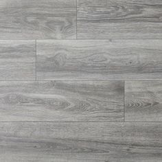 grey wood flooring that looks like it has been painted with white paint and is very light