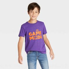 Cat & Jack 'Game Mode' Graphic Short Sleeve T-Shirt For Boys, Size Medium (8/10) Your Gamer Will Love Spending Long Afternoons And Evenings Playing Their Favorite Online Games In This Short-Sleeve "Game Mode" Graphic T-Shirt From Cat And Jack. Made From Soft Fabric, This Short-Sleeve T-Shirt Offers All-Day Comfort, While The Below-Waist Length Gives The Option Of Wearing It Tucked Or Untucked. In A Solid Hue, This Crewneck Tee Features The Phrase, "Game Mode," Written In A Bold Orange Font, With Playful Purple Cotton T-shirt, Playful Purple Cotton Tops, Playful Purple Short Sleeve T-shirt, Playful Purple Short Sleeve Tops, Toddler Girl Halloween, Football Graphic Tee, Toddler Girl Shorts, Game Mode