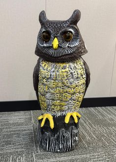 an owl statue sitting on top of a table