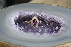 Vintage style ring set with a .85 carat Marquise faceted Amethyst, along with .20 cttw of natural round brilliant cut diamonds, complete in a 14 karat Rose gold vintage filigree style setting. Beautiful as a unique engagement ring, or just another piece to add to your collection.  Amethyst is the birthstone for February and one of the emblems of the twelve apostles. Fine amethysts have been set in religious jewelry and royal crown jewels for ages. It was once considered equal in value to ruby, emerald, and sapphire. 14k Gold Amethyst Ring With Diamond Accents For Wedding, Wedding Amethyst Ring With Diamond Accents In 14k Gold, Wedding Amethyst Diamond Ring With Accents, Wedding Amethyst Diamond Ring With Diamond Accents, Amethyst And Diamond Ring With Vvs Clarity For Wedding, Purple Rose Cut Diamond Ring, Purple Diamond Ring With Rose Cut Diamonds, Amethyst Diamond Ring With Rose Cut Diamonds For Anniversary, The Twelve Apostles