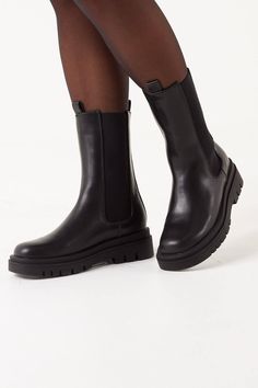 These mid calf boots are both comfortable and stylish, featuring a faux leather, elasticated inserts and chunky sole. Wear with short dresses or skirts.   Black Boots Faux Leather Elasticated Inserts Chunky Sole Thrift Board, London Shoes, Girly Shoes, Calf Boots, Chelsea Boot, Mid Calf Boots, High Boots, Mid Calf, Rubber Rain Boots