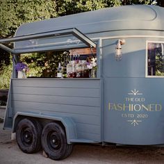 an old fashion food truck is parked outside