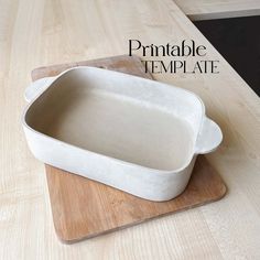 a white dish sitting on top of a wooden cutting board