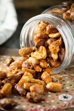 a jar filled with nuts on top of a table