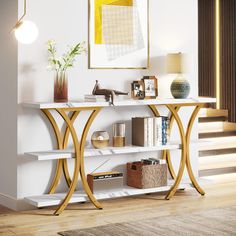 a white shelf with books and vases on it in front of a staircase way