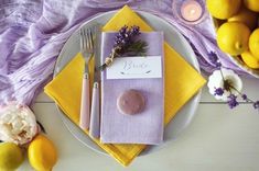 a place setting with lavender and lemons