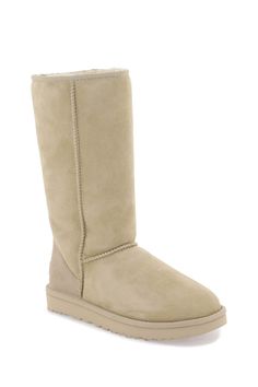 UGG Classic Tall II boots crafted in stain and water resistant suede leather with raised stitching, soft sheepskin lining, leather patch with debossed logo applied on the heel and rear loop. Sheepskin insole and Treadlite rubber sole. Material: 100% leather, 100% LW Size Type: ITSKU: 1016224 MDSD-1 This is a final sale clearance product. Our Products Are 100% Genuine. In All Cases We Stand By The Authenticity Of Every Product Sold On Our Site. Leather Boots For Winter, Classic Beige Boots With Reinforced Heel, Winter Beige Calf Leather Boots, Beige Sheepskin Boots With Round Toe, Classic Sheepskin Boots With Suede Lining, Classic Boots With Sheepskin And Suede Lining, Classic Winter Boots With Suede Lining, Classic Fall Suede Waterproof Boots, Classic Suede Waterproof Boots For Fall