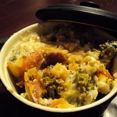 a bowl filled with food sitting on top of a table