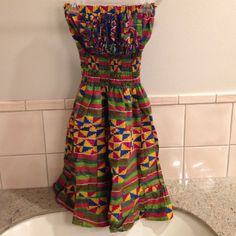 Brand New, Never Worn, No Tags. Custom Ordered And Handmade Dress From Ghana, Purchased While On A Trip. Very Colorful And Festive. Skirt Is Great For Twirling Around. Entire Length Of Dress Between 35-36 Inches Long. Because Of Smoked Material, Can Fit Xs-M. Casual Multicolor Knee-length Sundress, Multicolor Bandeau Summer Dress, Multicolor Smocked Bodice Dress For Spring, Multicolor Bandeau Dress For Vacation, Sundress With Smocked Bodice And Bandeau Shape, Spring Multicolor Dress With Smocked Bodice, Bandeau Sundress With Smocked Bodice, Casual Strapless Bandeau Dress With Smocked Back, Bohemian Strapless Dress