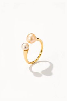 Blush with elegance with the Blush Pink Pearl Ring, where sophistication meets femininity in a chic design. This ring features a delicate band adorned with a lustrous blush pink freshwater pearl, adding a subtle pop of color to any ensemble. Crafted with versatility in mind, this ring pairs beautifully with both casual and formal outfits. Whether you're dressing up for a night out or adding a touch of glamour to your everyday look, this ring is sure to make a statement. Pink Pearl Ring, Gemstone Earrings Gold, Formal Outfits, Pearl Gemstone, Pink Pearl, Pearl Ring, Cultured Pearls, Chic Design, Ring Bracelet