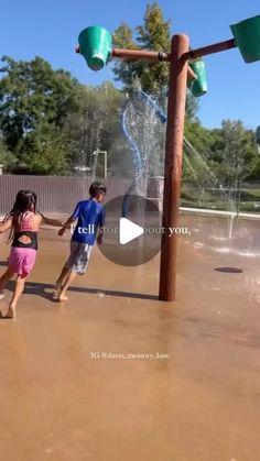 two children playing in a water play area