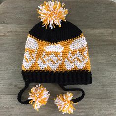 a knitted hat and two matching hair clips