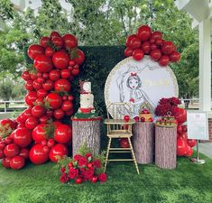 an outdoor display with tomatoes and other decorations