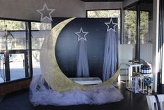 an image of a stage set up with stars on the moon and curtains around it