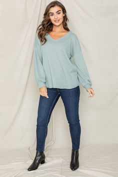 Balloon Sleeve V Neck Top Made In: United States Expertly crafted in the United States, this top boasts a flattering v-neck and trendy balloon sleeves. Elevate your wardrobe with a sophisticated and stylish piece that is sure to impress. Chic Relaxed Fit V-neck Top For Fall, Spring V-neck Long Sleeve Loungewear Top, Versatile V-neck Knit Top For Day Out, Trendy Puff Sleeve V-neck Top For Fall, Versatile V-neck Long Sleeve Top For Fall, Trendy V-neck Top With Blouson Sleeves, Fall V-neck Puff Sleeve Top With Blouson Sleeves, Trendy Balloon Sleeve Tops For Day Out, Trendy Oversized V-neck Blouse