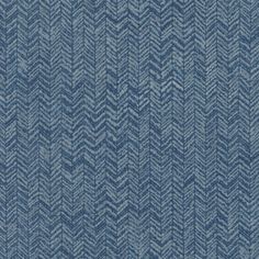 an upholstered blue fabric textured with herringbones