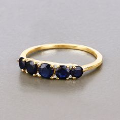 14Kt Gold, Blue Sapphire Ring, Sapphire Jewelry, Gold Sapphire Ring, Minimalist Gold Ring, Minimalist Gold Ring, Sapphire, Rings For Women  Talk about serene beauty! This stunning 5 stone ring features a round genuine blue sapphire in a pop of vibrant color. With 1.05 carats, it's a gorgeous glam for your finger and a fashion must-have for your wardrobe. Crafted in 14k yellow gold with fine finish. Product Details:  14K Yellow Gold Stone Details: Blue Sapphire Item Type: Ring Gross Wt: 1.76 Gems 5 Stone Sapphire Ring, Gold Sapphire Ring, Blue Topaz Jewelry, 18k Gold Jewelry, Aquamarine Jewelry, Silver Gemstone Jewelry, Blue Sapphire Rings, Sapphire Jewelry, Sapphire Diamond