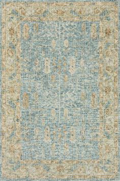 an area rug with blue, yellow and beige colors on it's edges is shown