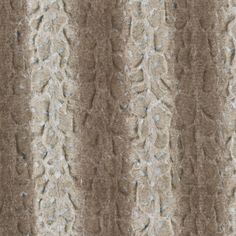 an image of a textured wallpaper pattern in brown and beige tones with blue accents