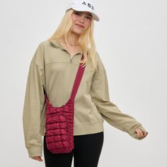 Woman wearing Burgundy Sol and Selene Let It Flow - Quilted Puffer Crossbody 841764110389 View 1 | Burgundy Cloud Bag, Let It Flow, Yoga Travel, Cell Phone Bag, Yoga Mat Bag, Exterior Details, Mat Bag, School Shopping, Stay Hydrated