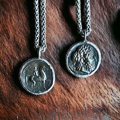 Marvelous reproductions of ancient Greek coins cast in bronze and set in a sterling silver setting.  The coin a features a bearded man on the from and a horse and rider on the back.   Hung on chunky oxidized silver wheat chain with lobster claw clasp.   Coin: 1" diameter  Chain:  Stainless Steel.  Choose your length.  Ready for gifting in a hand-stamped gift box and bow. To see all the goodies in my shop, click here: www.etsy.com/shop/OneTribeJewelry Roman Necklace, Mens Silver Chain Necklace, Necklace For Him, Old Necklace, Ancient Greek Coin, Horse And Rider, Silver Chain For Men, Greek Coins, Bearded Man