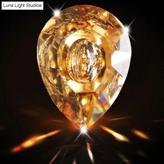 an image of a diamond on a black background with the words luma light studios