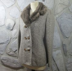 This is a vintage wool tweed jacket from the 50's. Brown pattern tweed. Double-breasted look. Faux fur collar. Lined in brown acetate. Excellent condition. Fits up to a 38" bust. Length is about 24" from top of shoulder to bottom edge. Fur Collar Jacket, Brown Pattern, Collar Jacket, Faux Fur Collar, Fur Collar, Fur Collars, Vintage Wool, Tweed Jacket, Vintage Brown