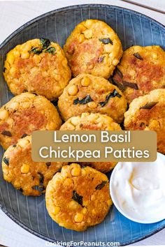 lemon basil chickpea patties on a plate with ranch dip and sour cream