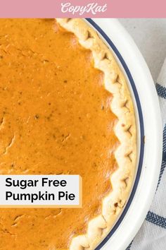 a close up of a pie on a plate with the words sugar free pumpkin pie