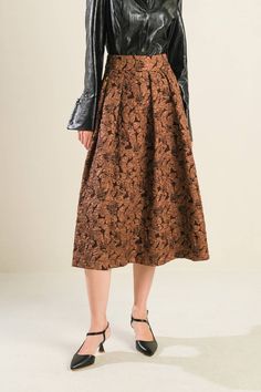 A textured woven full midi skirt with back zipper closure Details: Self : 100% Polyester Size & Fit - Model is 5`8" And Wearing Size Small- Measurements Taken From Size Small- Approx. Length: 32" Chic Brown A-line Skirt, Fall Midi-length Pleated Skirt, Brown Midi Skirt For Fall, Knee-length Pleated Skirt For Fall Party, Brown A-line Skirt For Spring, Brown Full Skirt For Workwear, Fall Party Knee-length Pleated Skirt, Voluminous A-line Skirt For Fall, Brown Full Skirt For Work