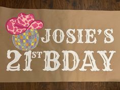 a sign that says josie's 21st birthday with a cupcake on it