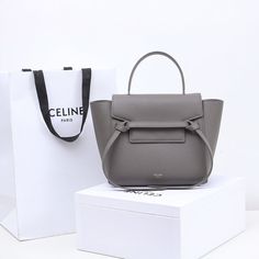 PT - COL Bags - 246 Modern Bucket Bag With Top Carry Handle For Gift, Modern Square Bucket Bag As Gift, Chic Gray Shoulder Bag With Dust Bag, Modern Double Handle Box Bag For Gift, Modern Double Handle Box Bag As Gift, Modern Gray Square Shoulder Bag, Elegant Gray Bag For Gift, Modern Gray Shoulder Bag With Dust Bag, Luxury Backpack