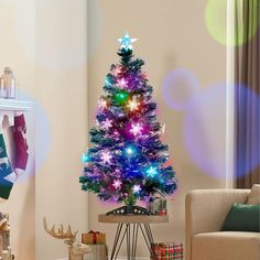 a brightly lit christmas tree in a living room