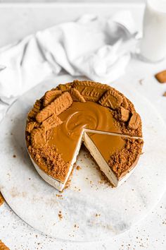 a chocolate cheesecake with a slice missing from it