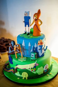 a colorful cake with cartoon characters on it