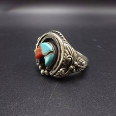 "VINTAGE NAVAJO RING DESCRIPTION: This tremendous ring features a raised inlay naja of turquoise and coral. Surrounding the inlay is a naja of sterling silver, flanked by applied leaves, scrolls, and raindrops. This fabulous ring will be a treasured addition to your collection of fine vintage Native American jewelry. MEASUREMENTS: Ring face measures 3/4\" north to south RING SIZE: 11 WEIGHT: 16.2 grams SIGNED: no STERLING: yes, stamped STERLING" Traditional Sterling Silver Rings With Inlay, Southwestern Polished Turquoise Ring Collectible, Traditional Silver Turquoise Ring With Inlay, Southwestern Style Rings With Inlay For Gift, Southwestern Style Rings With Inlay As Gift, Traditional Turquoise Inlay Ring, Jewelry Measurements, Navajo Ring, Turquoise Men